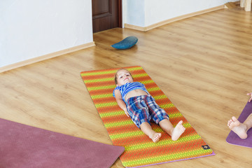 Little boy on a yoga class