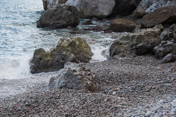 rocks by the sea in a small storm in high quality
