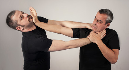 Street fighting self defense technique against holds and grabs