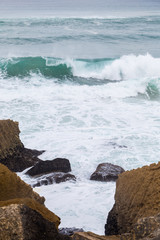 atlantic coastline with surfes in cloudy day
