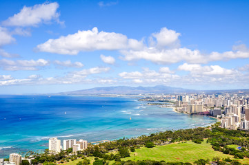 Fototapeta premium Panorama view of Honolulu and Waikiki Beach seen from Diamond Head Crater on the island of Oahu, Hawaii, USA. Hawaii is a popular tourist destination for Americans and Asians.