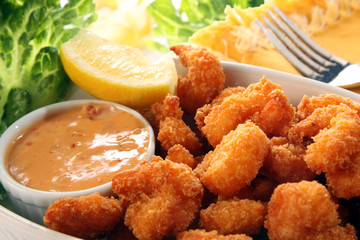 Fried shrimp with cocktail sauce.