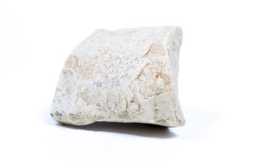 Single natural stone on white background