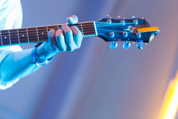 The image is part of the instrument, the guitar while in use.