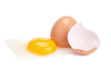 Close up of cracked egg on white background.
