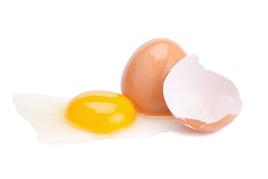 Close up of cracked egg on white background.