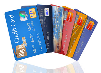 Credit cards are fanned out and isolated on background.