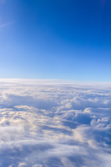 Fototapeta premium white clouds and blue sky skyscraper. view from the window of an
