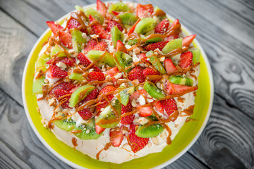 Pavlova Cake with strawberries and kiwi