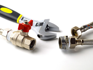 flexible fittings, ball valve and adjustable wrench on white background