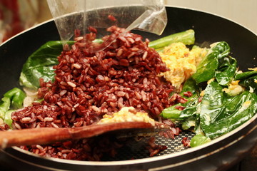 Cooking , Fried organic black rice  with Thai sour sausage and k