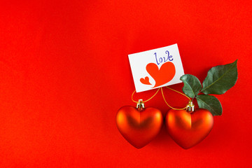 Red heart Valentines with message card on red background Image o