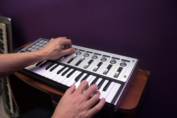 Man is using MIDI keyboard
