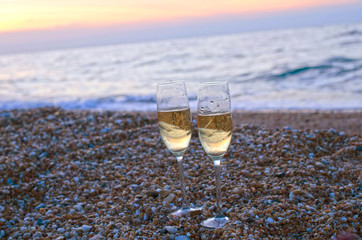Wineglass on the beach in the evening