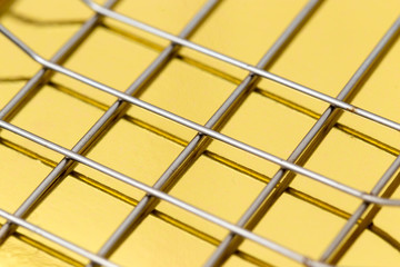 metal mesh on a gold background