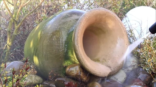 cleaning amphora with pressure washer, spring
