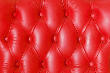 Buttoned on the red texture from sofa