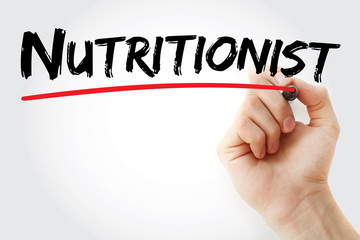 Hand writing Nutritionist with marker, concept background