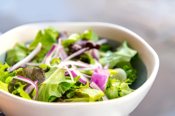 Delicious fresh salad and olive oil