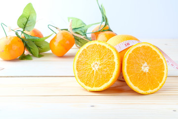 Fresh oranges on a wooden table