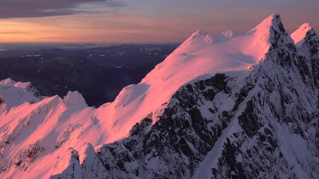 Amazing Aerial Shot Best Sunset Red Reflection on Three Fingers Peak - North Cascade Mountains. Panoramic Helicopter Shot Grand Red Light Alpenglow - Majestic San Juan Islands Landscape View Orange