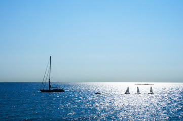 Landscape of azure sky blue sea with sailing vessel on it