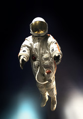 Astronaut in outer space, on a background of blue, infinite spac