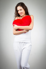 Woman Holding Heart-shaped Pillow