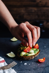Making Avocado with Cherry Tomatoes on Toast for Lunch