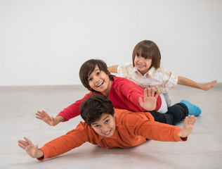 Happy boys on ground flying