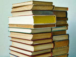 pile of old books in hardcover