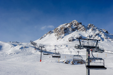 Ski lift in mountains at winter