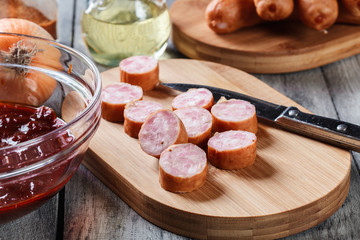 Ingredients ready for preparing German currywurst with curry sauce