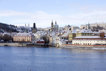 Christmas romantic snowy Prague City with St. Nicholas' Cathedral , Czech Republic