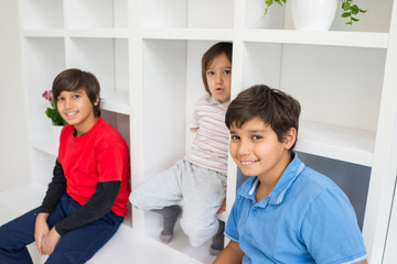 Fototapeta premium Happy children having fun and posing in new modern home