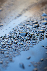 drops of water on a dark car