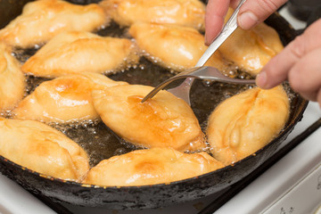 patties are fried in a pan