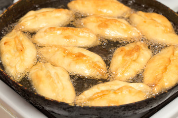 patties are fried in a pan