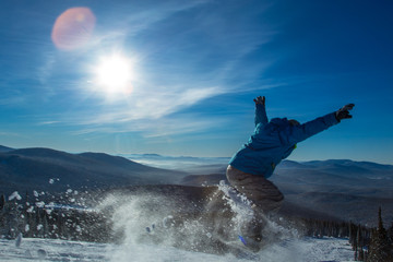 Obraz premium Skier on off-piste slope in forest riding very fast. Ski backcountry resort Sheregesh.
