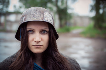will rub girls in an old military helmet of times  World War II