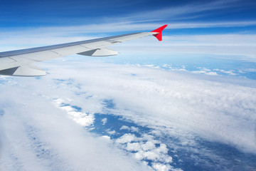 Fototapeta premium Above the clouds.Wing aircraft on the sky