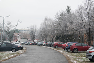 Obraz na płótnie Canvas Outdoor car park with snow and ice on a cold winter day