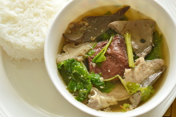 boiled pork blood and entrails soup eat couple with rice on dish