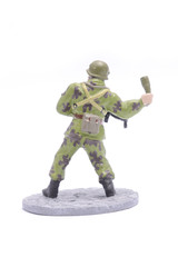 Tin Soldier throws grenade isolated on white