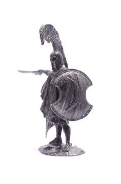 tin soldier Spartan warrior with sword and shield isolated on wh