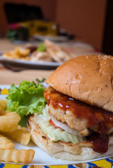 Close up of hamburger and fries.