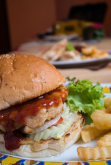 Close up of hamburger and fries.
