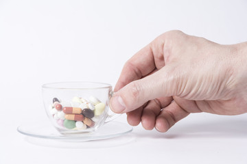 Cup of coffee with pills