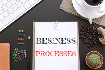 Text Business processes on white paper background / business concept