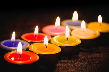 Selective focus of Candle flame light at night with night background.